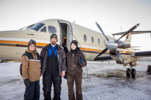 Deb and Rolland Trowbridge and Tara Cicatello, departing Nome for Bethel to compete in the Kuskokwim 300, a mid-distance sled dog race in southwestern Alaska.