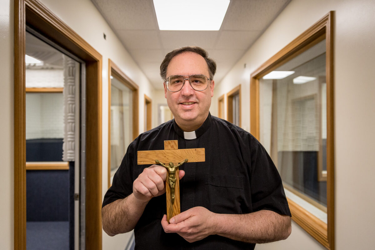 Father Ross Tozzi in KNOM's new digital studios