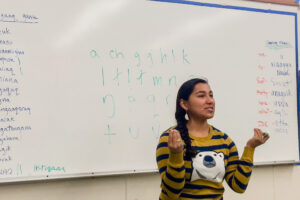 Marjorie Tahbone, the vice chair of Inuusiq, Inc., teaching an Inupiaq class at the Nome high school.