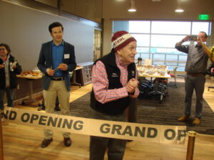 Nome Mayor Richard Beneville cuts the ribbon with representative Neal Foster to kickstart the opening of the cultural center, museum, and library in the Richard Foster Building.
