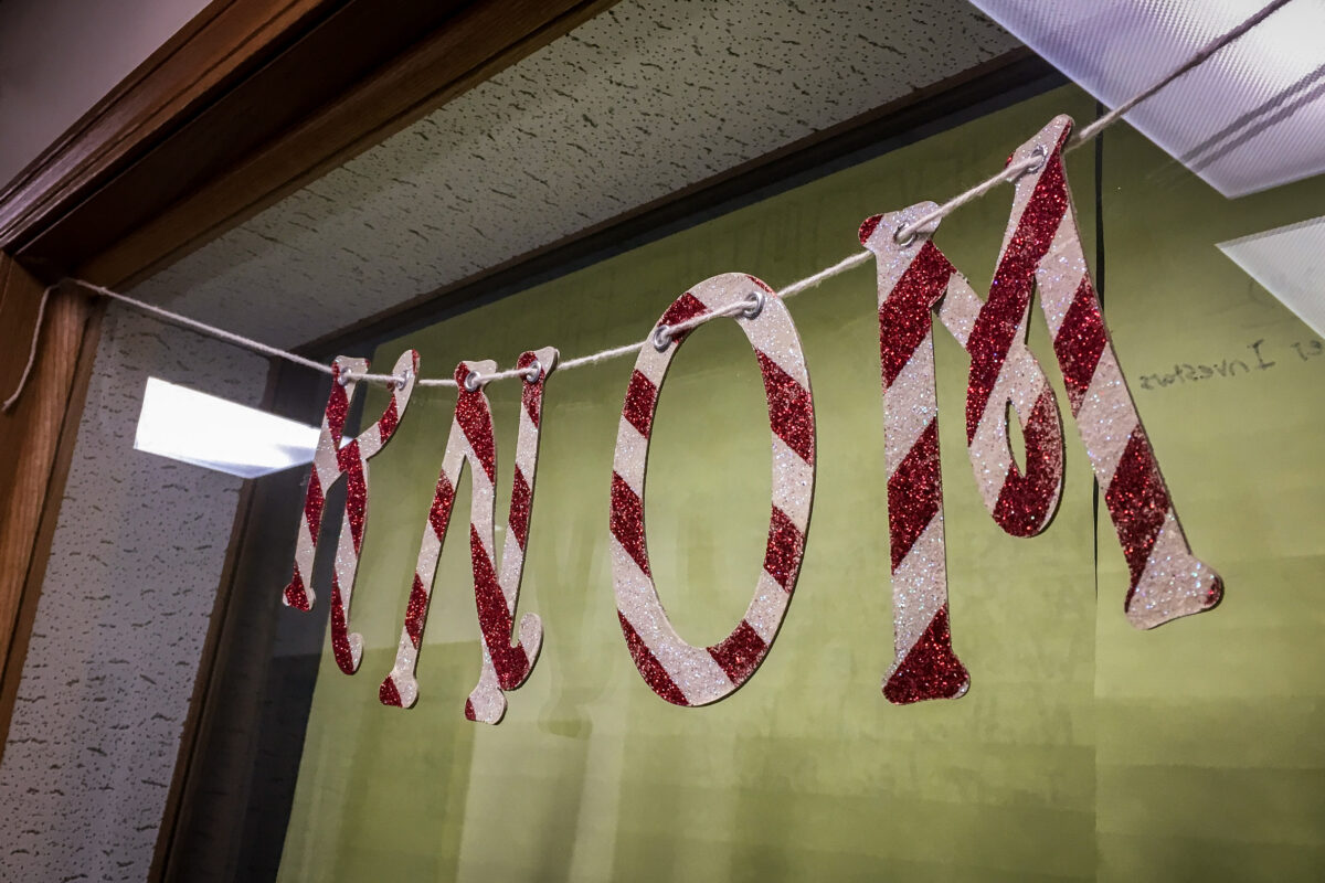 "KNOM" in candy-cane-style letters