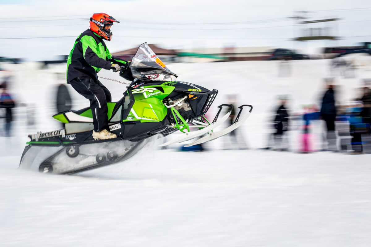 A Nome-Golovin racer speeds from the starting line on his snowmachine
