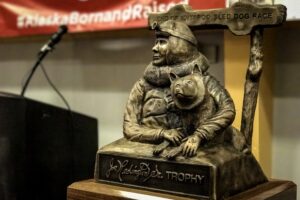 A trophy of Joe Redington, Sr. — known as the father of the Iditarod — awaits the 2017 champion at the finisher's banquet in Nome on Sunday afternoon.