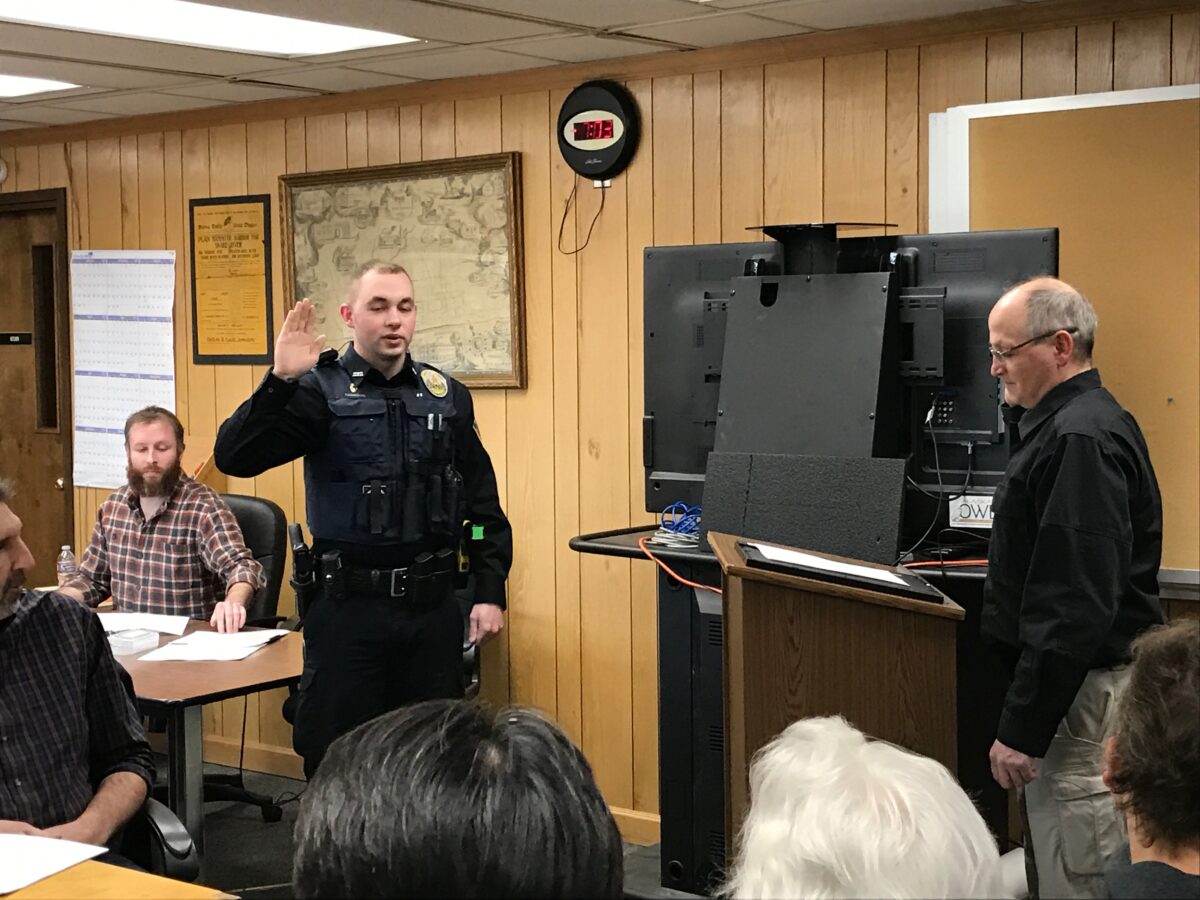 Wade Harrison takes the oath to become a Nome police officer. Nome City Council meeting, Monday, April 10, 2017.