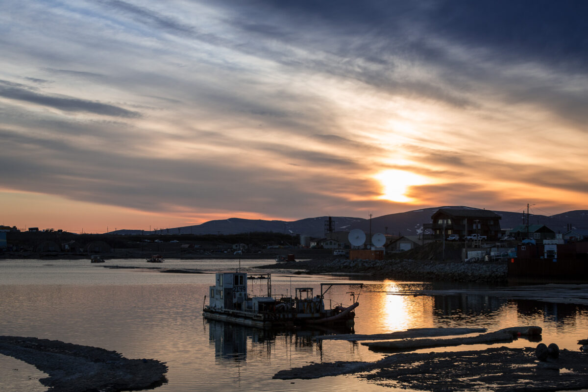 The sun hangs low over the Nome port, past midnight on a June evening.