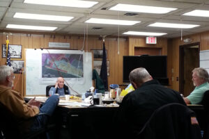 City Council members gather around the table during a work session followed by regular meeting. Photo Credit: Davis Hovey, KNOM (2017)