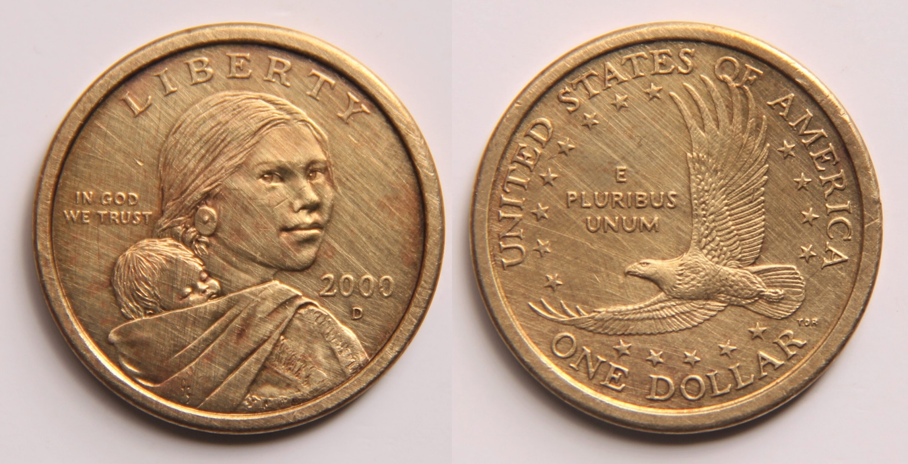 Front and back of 2000-era US dollar coin, featuring Sacagawea