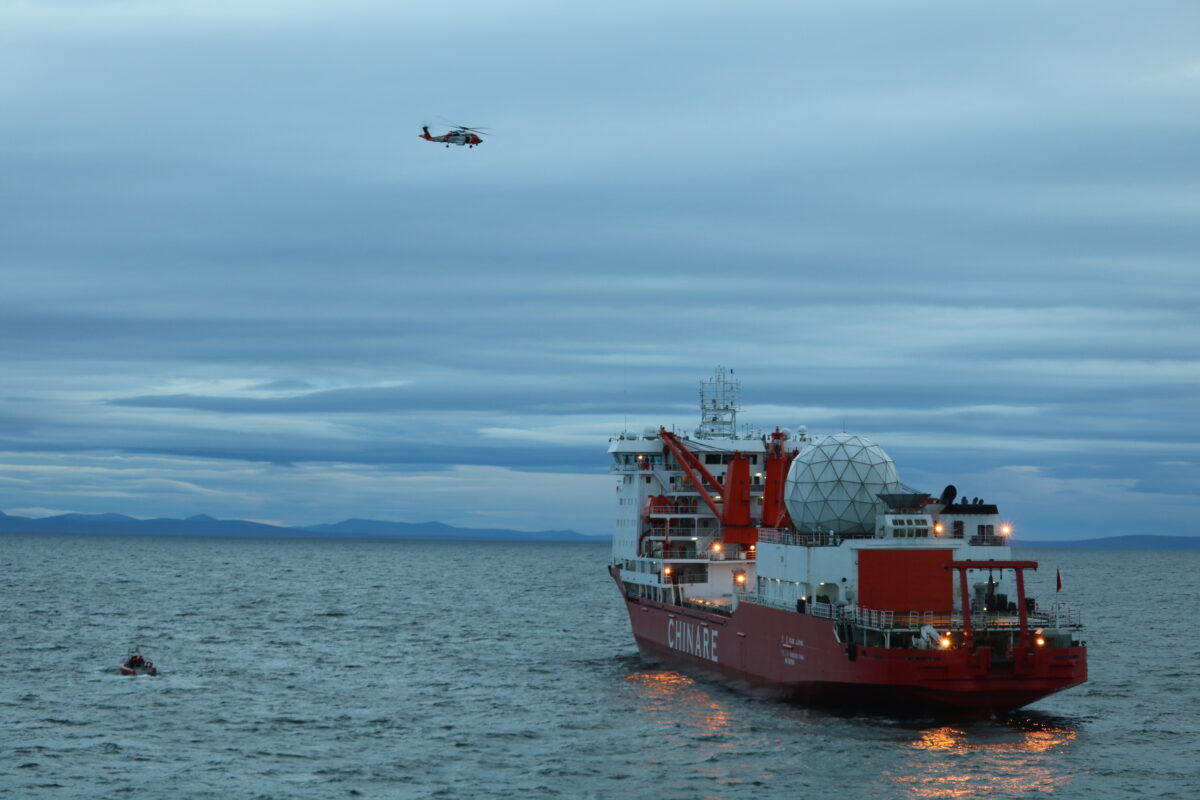 A small boat crew from the Coast Guard Cutter Alex Haley medevacs a man suffering a broken arm from the Chinese research vessel Xue Long, 15 nautical miles from Nome, Alaska, Sept. 23, 2017. U.S. Coast Guard photo.