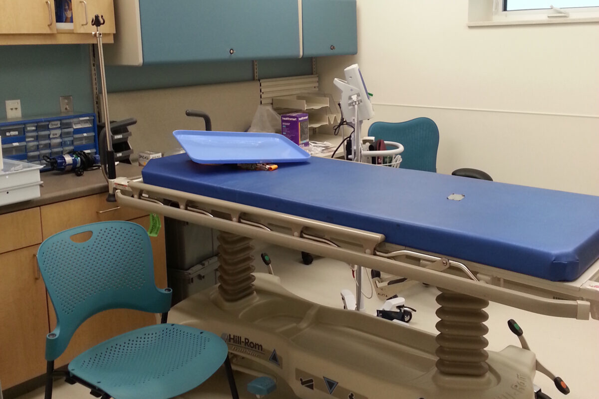 A blue and white medical exam room in the new Gambell clinic.