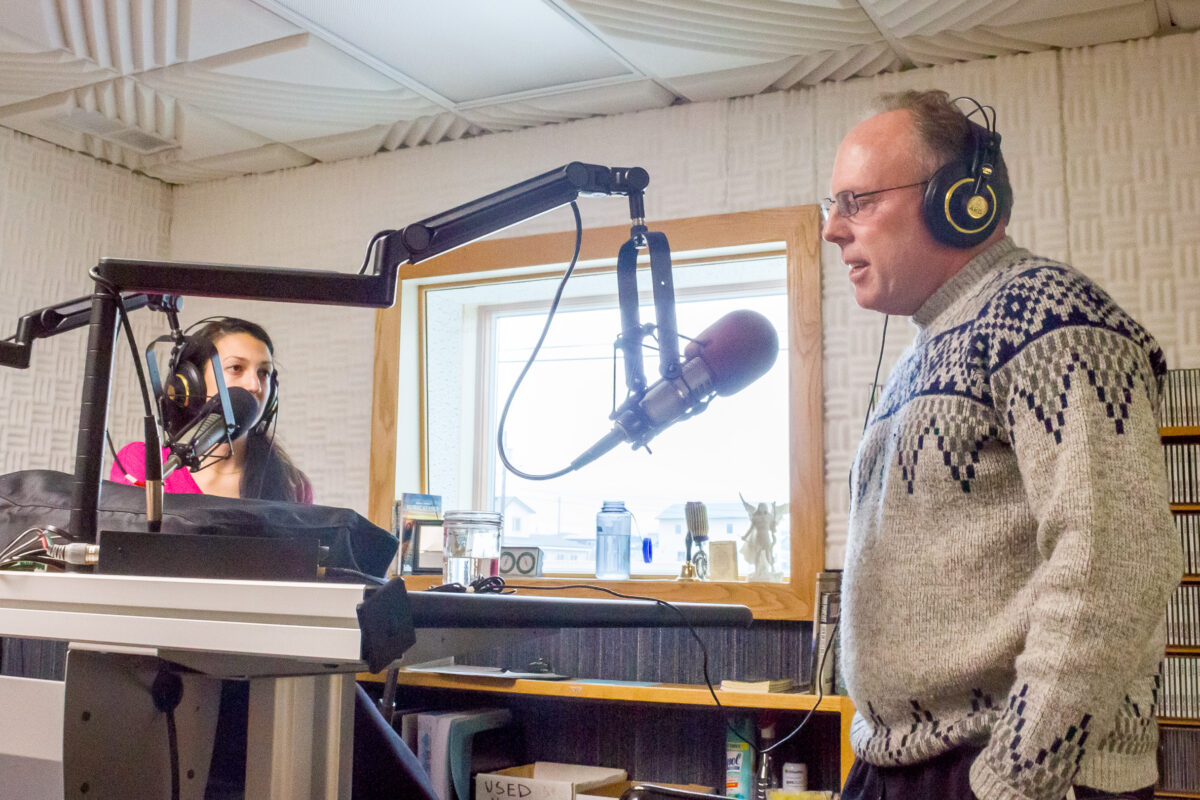 Margaret and Father Tom chat in KNOM’s Studio A