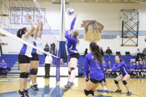 A Nome-Beltz player spikes the ball at a home game against Kotzebue