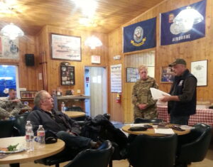 Major General Laurie Hummel with the DMVA and the Alaska National Guard stands beside Verdie Bowen during a public presentation at the VFW in Nome. Photo Credit: Davis Hovey, KNOM (2017)