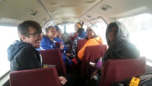 The Nome-Beltz cross-country team inside a Bering air plane, heading to Elim.