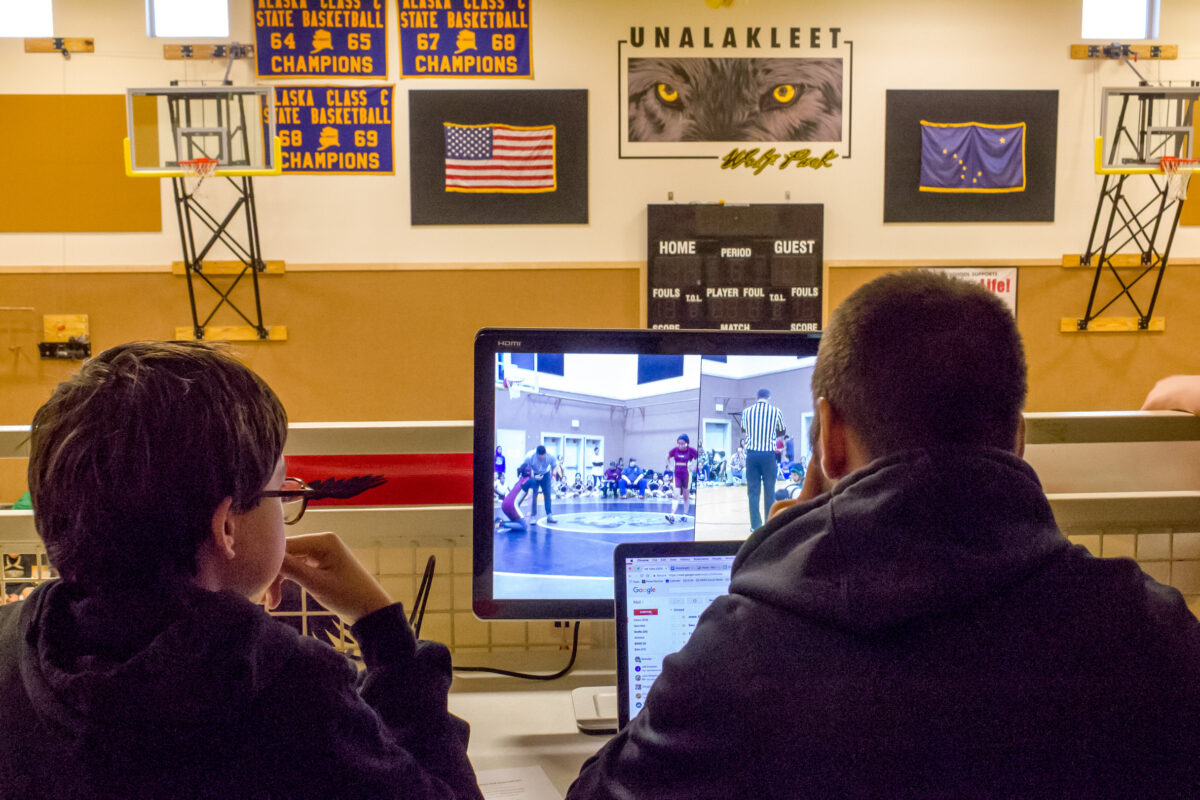 The BSSD Student Broadcasting team in action in Unalakleet, monitoring and capturing the action of the village’s wrestling/cheerleading tournament.