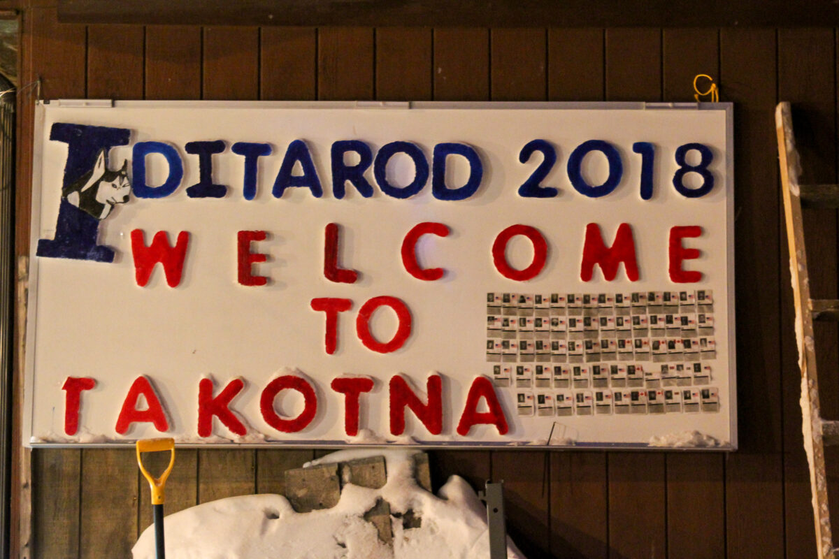 Sign reading “Iditarod 2018: Welcome to Takotna.”