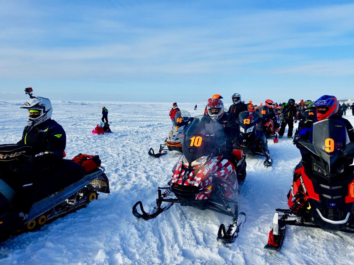 Racers line up at the start of the 2018 Nome-Golovin snowmachine race (Photo: Zoe Grueskin, KNOM)