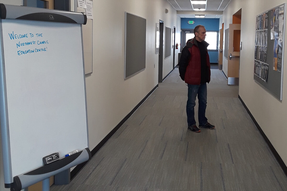 UAF Northwest Campus director, Bob Metcalf, stands in the hallway of the newly renovated education center. Photo Credit: Davis Hovey, KNOM (2018)