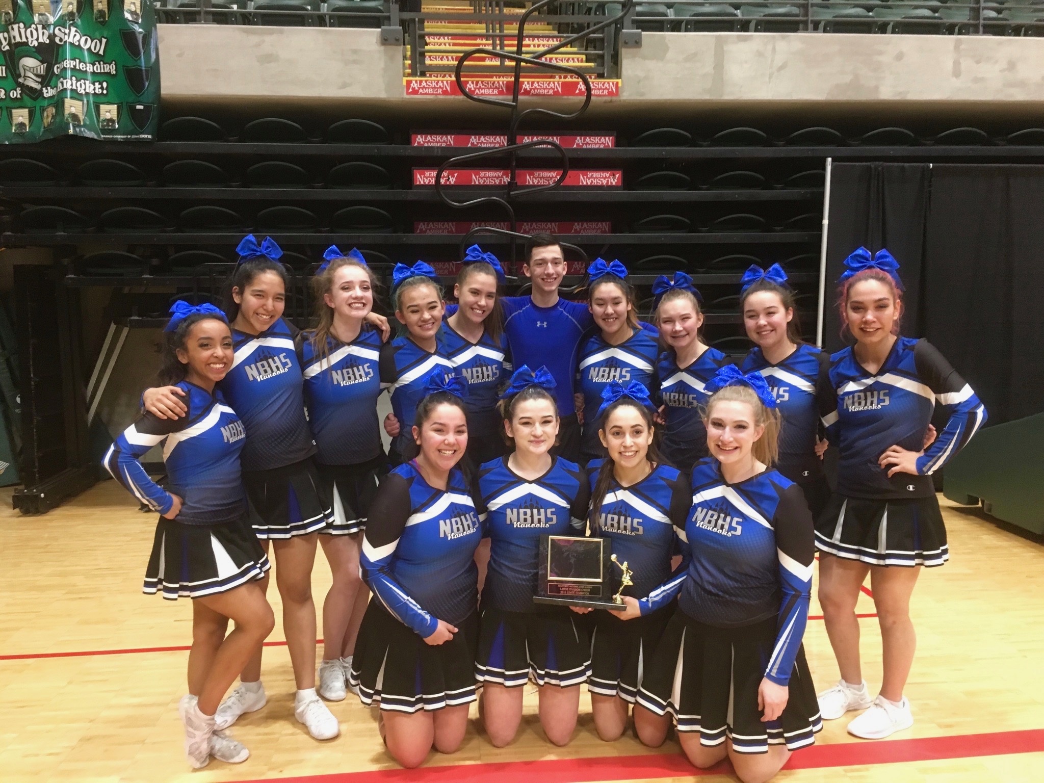 The Nome-Beltz Nanooks cheer team with their first-place trophy for the large division, 2018 (Photo courtesy of Elizabeth Coler, used with permission)