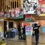 Handmade signs welcoming mushers and Easter baskets for local kids brighten the Ambler community hall, which serves as checkpoint headquarters during the Kobuk 440.