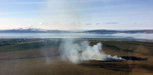An aerial view of smoke rising from a fire near the village of Golovin, Alaska.