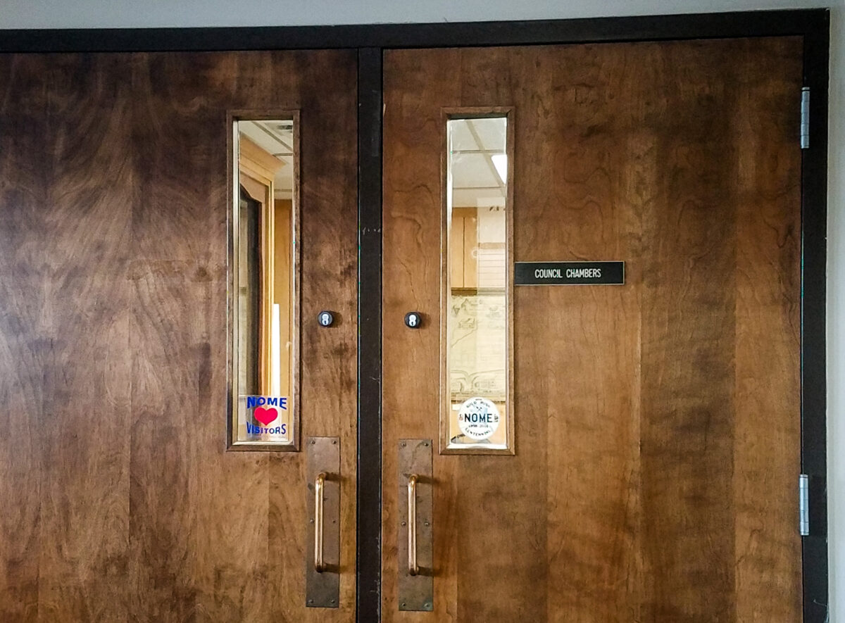 Double doors with a small placard reading "Council Chambers."