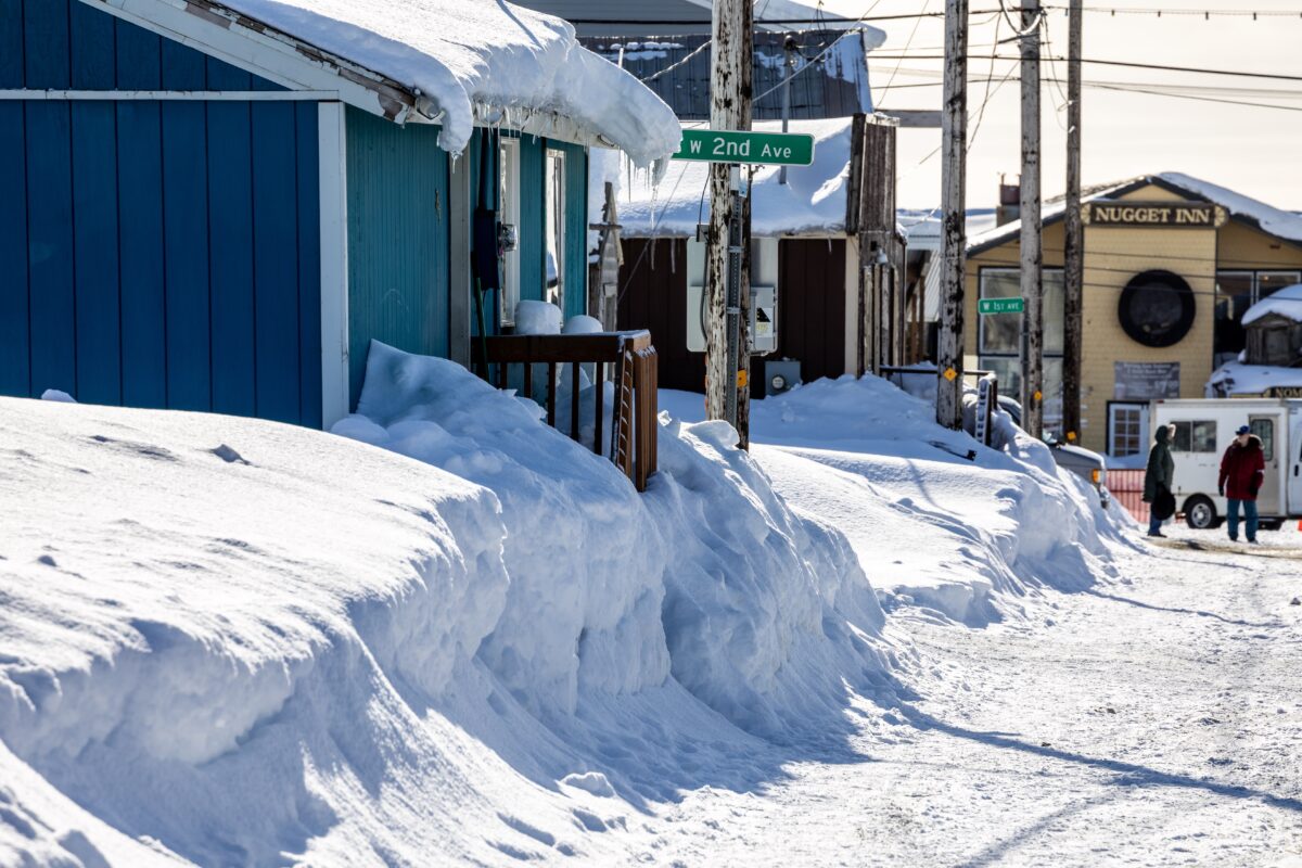 Daytime along a snowy street in rural Alaska