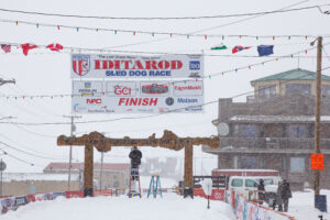 The burled arch in Nome being prepared for the Iditarod finish.