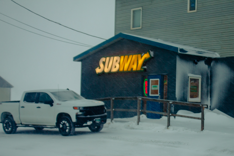 Exterior building of Subway in Nome on snowy day
