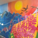 A colorful mural on the school wall