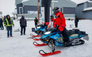 two snowmachine racers