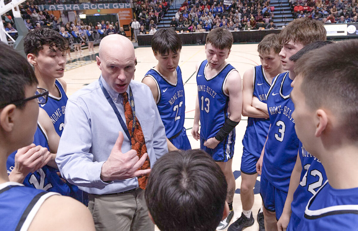 Nanook head coach Patrick Callahan talks strategy with his team at the 3A state championship game on Saturday, March 25.