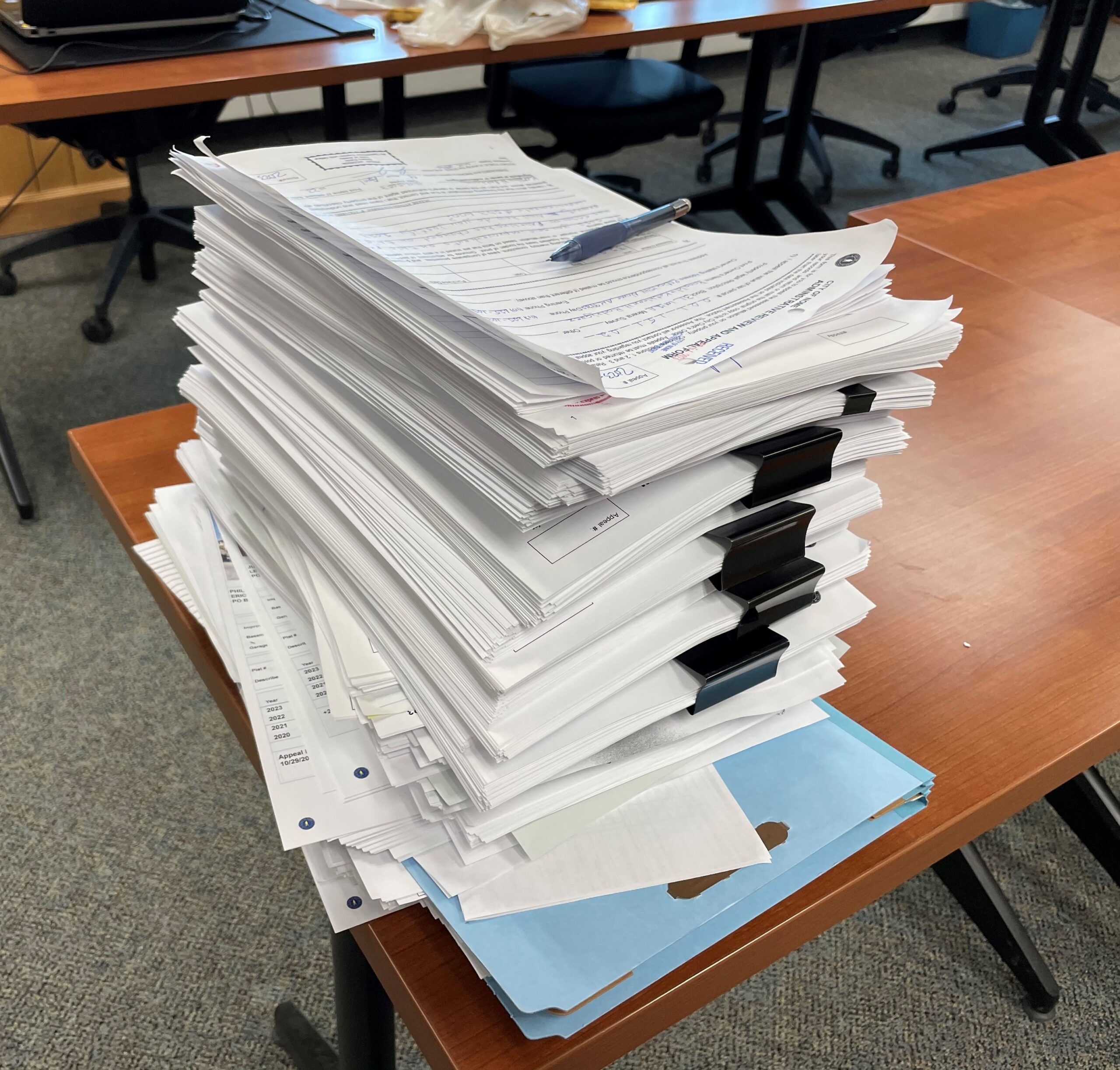 More than 1,000 pages of assessment appeals and supporting documentation are being reviewed by the city's assessors. Photo by Greg Knight/KNOM