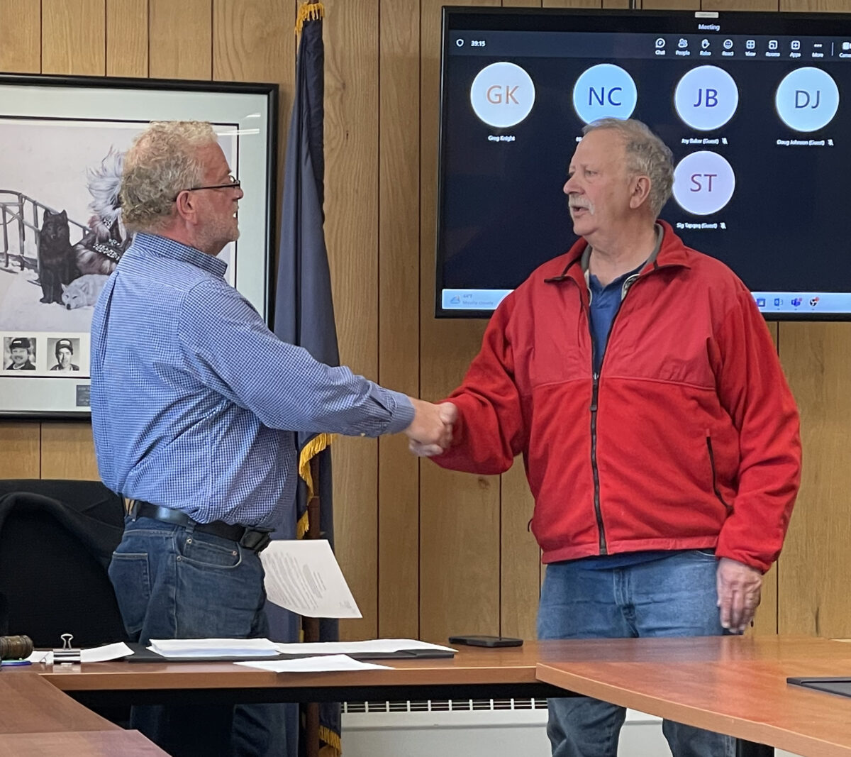 Image at top: Nome Mayor John Handeland congratulates Tom Vaden for his decades of service on May 22.