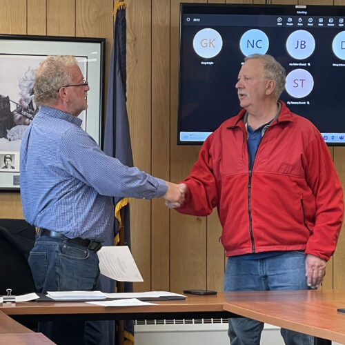Image at top: Nome Mayor John Handeland congratulates Tom Vaden for his decades of service on May 22.