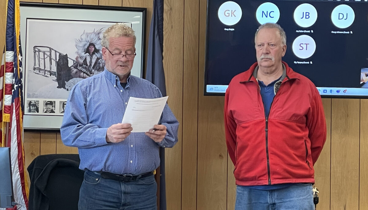 Nome Mayor John Handeland reads a proclamation honoring Vaden during the May 22 Nome Common Council meeting.