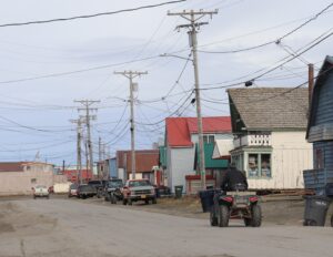 An ATV rider cruises down a street in Nome on Wednesday, June 7.