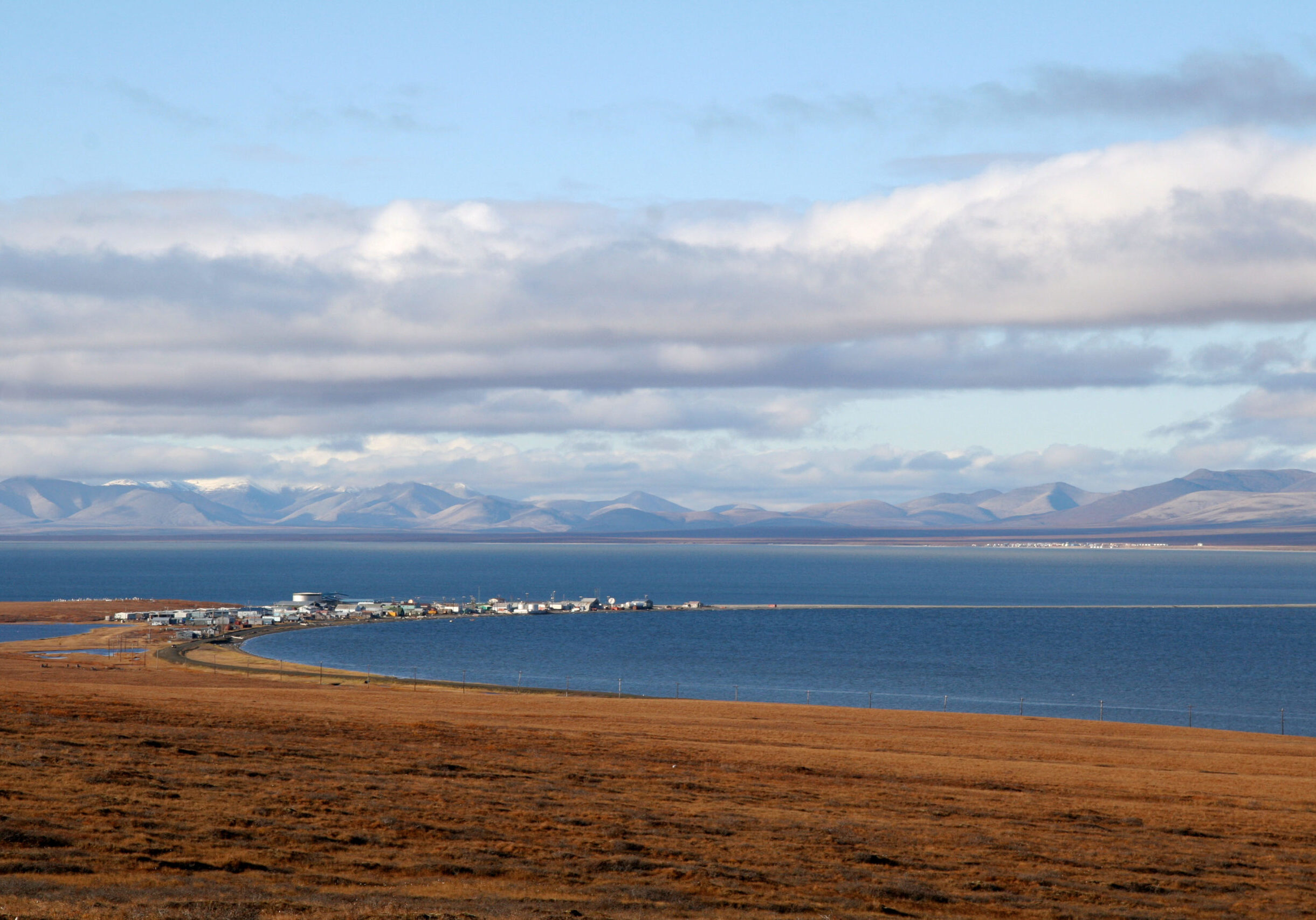 The community of Teller is in the foreground, with Brevig Mission faintly visible across the water. Photo: KNOM File.