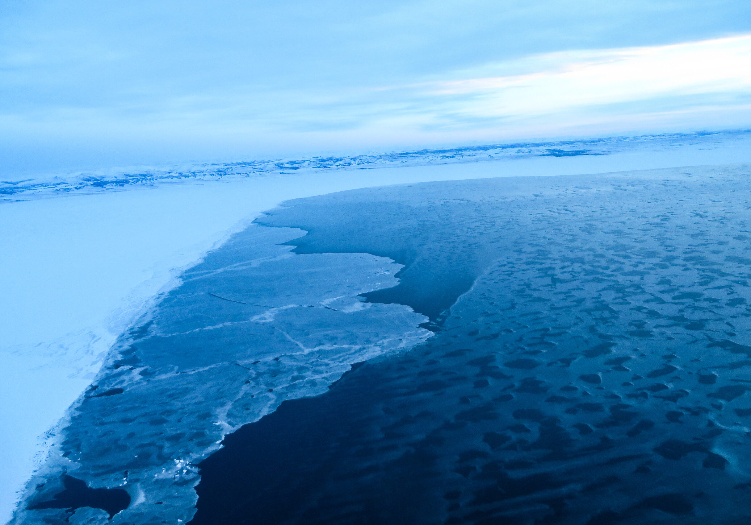 The sea ice, as seen flying past Shaktoolik ... Photo: Laura Kraegel, KNOM.