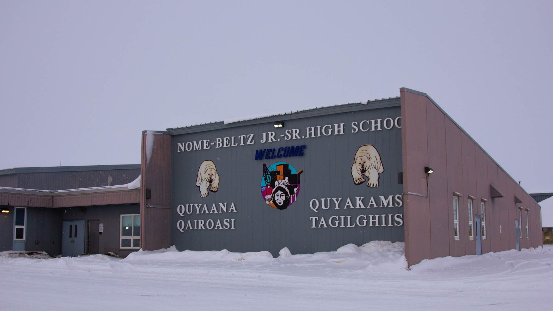 Nome-Beltz Middle High School sits amongst snow as temporary fixes to an aging roof cause persistent trouble for maintenance crews. KNOM stock photo.